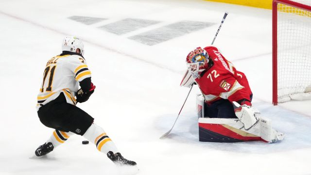 Boston Bruins forward Taylor Hall and Florida Panthers goalie Sergei Bobrovsky