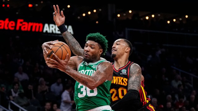Boston Celtics guard Marcus Smart, Atlanta Hawks forward John Collins