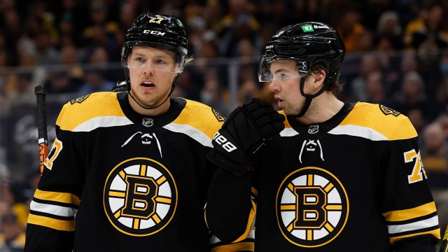 Boston Bruins defensemen Hampus Lindholm and Charlie McAvoy