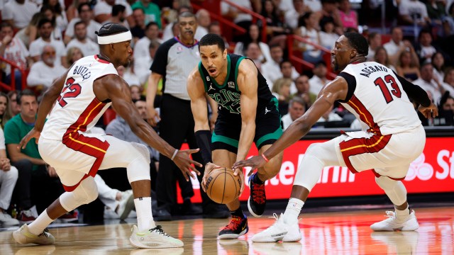 Boston Celtics guard Malcolm Brogdon and Miami Heat forward Jimmy Butler and center Bam Adebayo