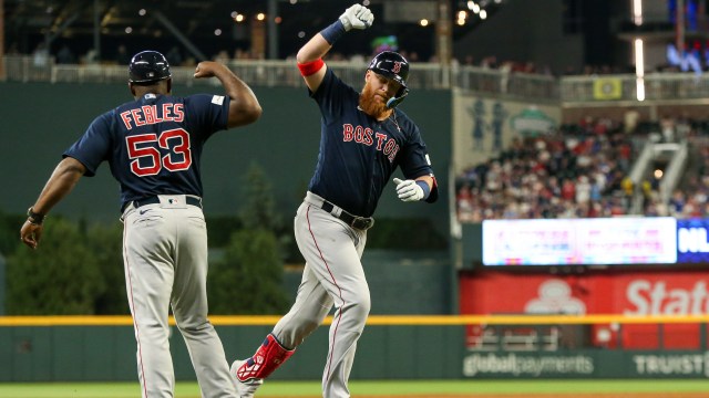 Boston Red Sox designated hitter Justin Turner, third base coach Carlos Febles