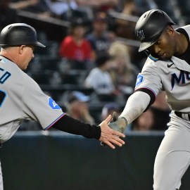 Florida Marlins third base coach Jody Reed and outfielder Jesus Sanchez