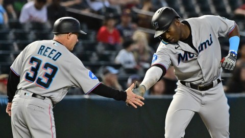 Florida Marlins third base coach Jody Reed and outfielder Jesus Sanchez