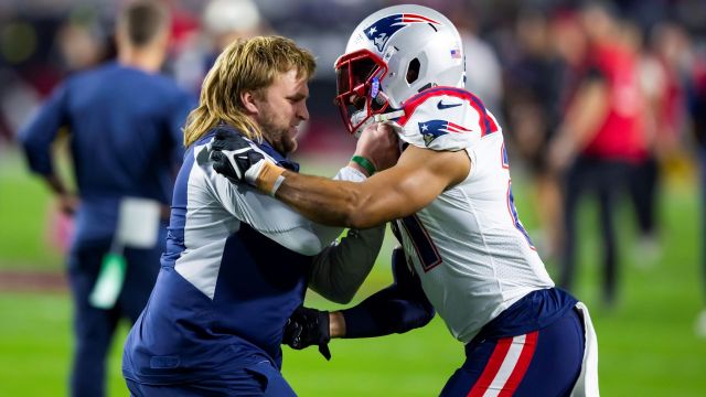 New England Patriots linebackers coach Steve Belichick and defensive back Adrian Phillips