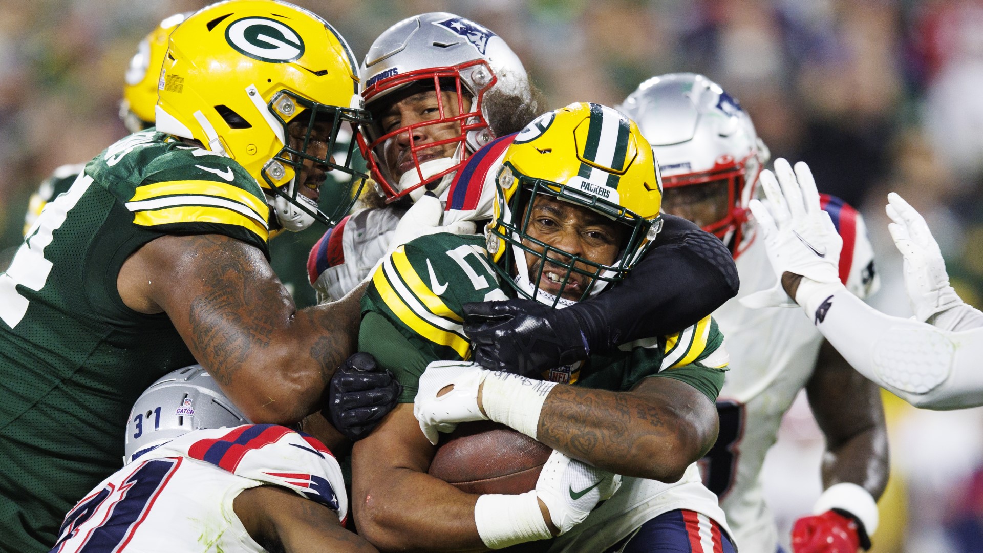 Packers escape Patriots in overtime at Lambeau Field