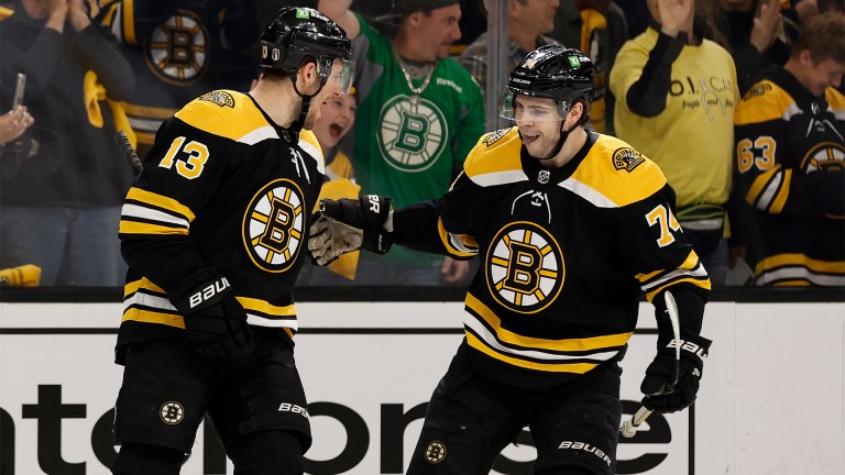 Boston Bruins forwards Charlie Coyle and Jake DeBrusk