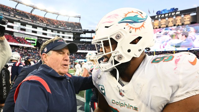 Miami Dolphins defensive tackle Christian Wilkins and New England Patriots head coach Bill Belichick