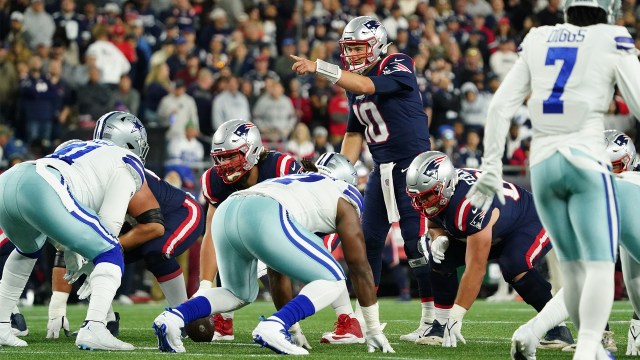 New England Patriots quarterback Mac Jones lines up against the Dallas Cowboys defense