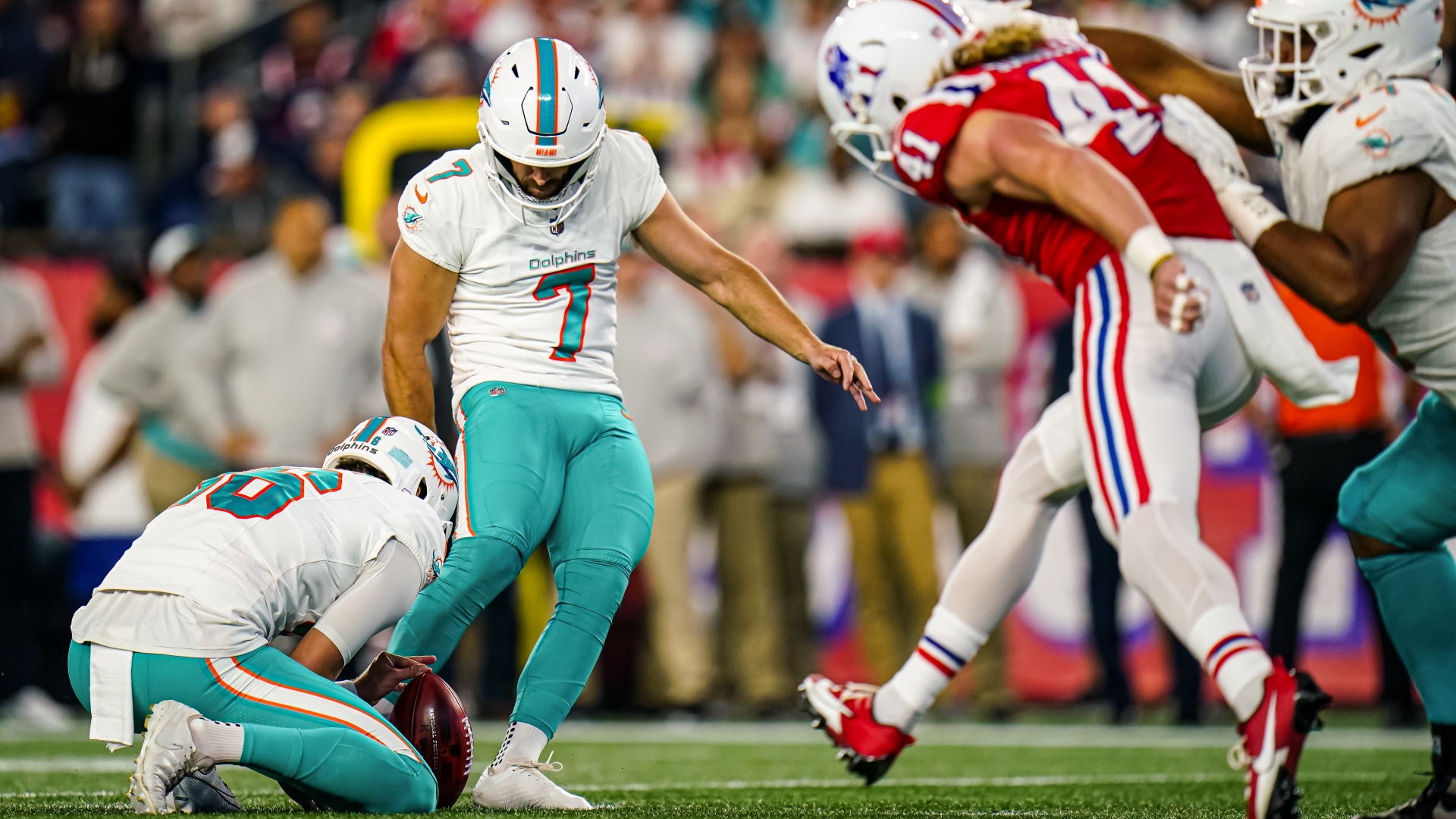 New England Patriots' Brenden Schooler blocks Miami Dolphins