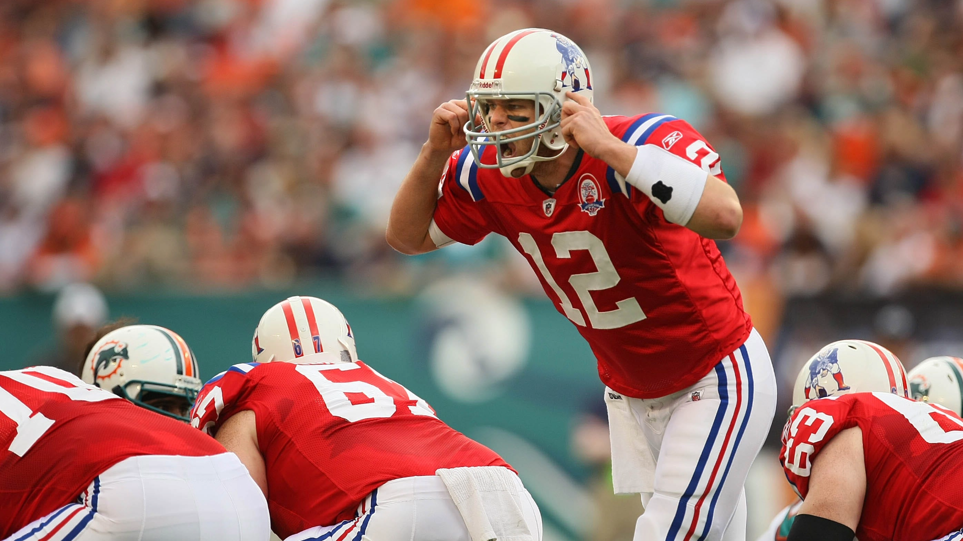 New England Patriots quarterback Tom Brady looks at the board