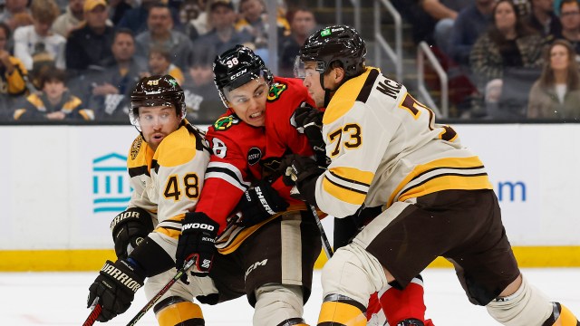 Boston Bruins defensemen Charlie McAvoy and Matt Grzelcyk