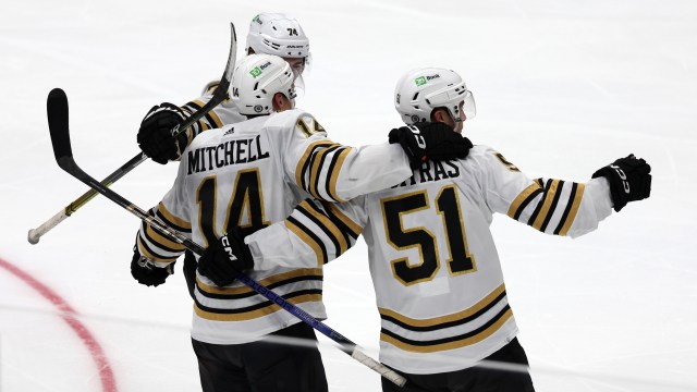 Boston Bruins defenseman Ian Mitchell and forward Matthew Poitras