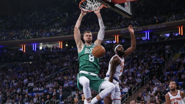 Boston Celtics center Kristaps Porzingis and New York Knicks center Mitchell Robinson