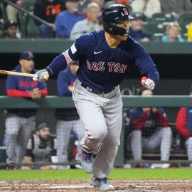 Minneapolis, Minnesota, on June 20, 2023. Masataka Yoshida of the Boston Red  Sox is congratulated by teammates in the dugout after hitting a two-run  home run in the eighth inning of a