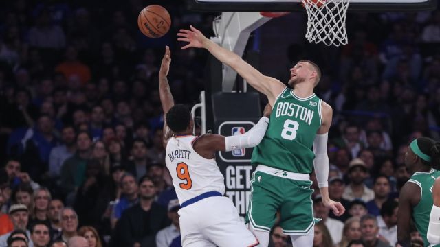 New York Knicks guard R.J. Barrett and Boston Celtics center Kristaps Porzingis