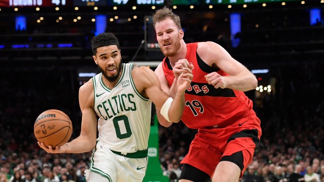 Boston Celtics forward Jayson Tatum and Toronto Raptors center Jakob Poeltl