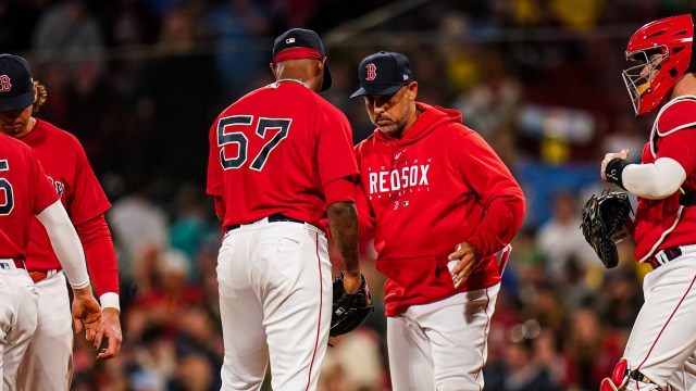 Boston Red Sox relief pitcher Joely Rodríguez and manager Alex Cora