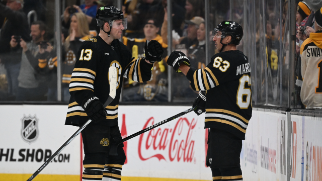 Boston Bruins forwards Charlie Coyle, Brad Marchand