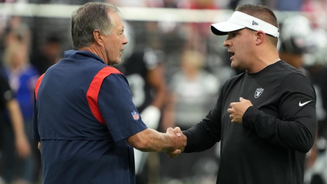 New England Patriots head coach Bill Belichick and NFL coach Josh McDaniels