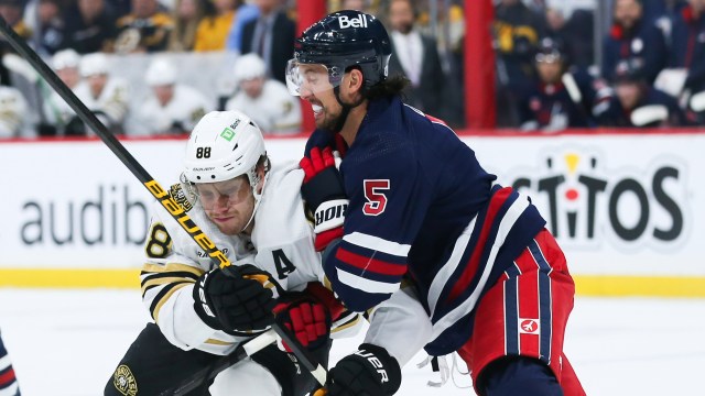 Boston Bruins forward David Pastrnak and Winnipeg Jets defenseman Brenden Dillon