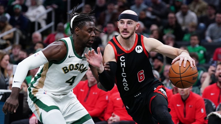 Boston Celtics guard Jrue Holiday and Chicago Bulls guard Alex Caruso