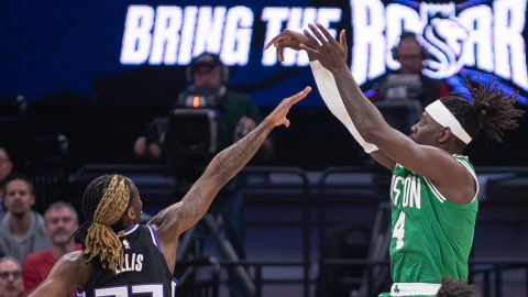 Boston Celtics guard Jrue Holiday and Sacramento Kings guard Keon Ellis