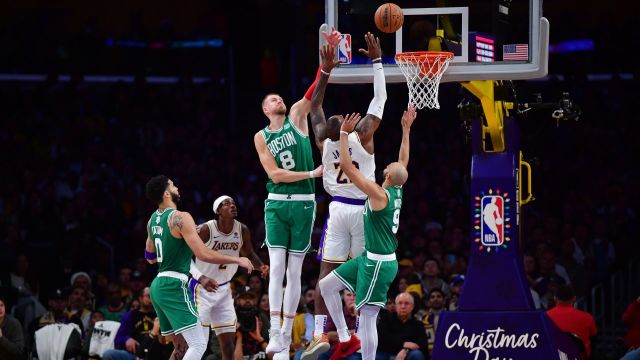 Boston Celtics center Kristaps Porzingis, Los Angeles Lakers forward LeBron James and Celtics guard Derrick White