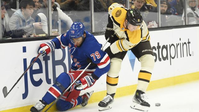 Boston Bruins forward Trent Frederic and New York Rangers defenseman K'Andre Miller
