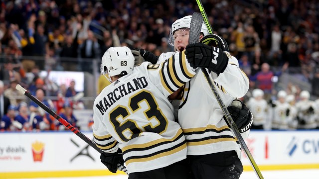 Boston Bruins forward Brad Marchand, defenseman Mason Lohrei