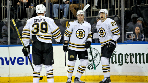 Boston Bruins forwards Charlie Coyle, James van Riemsdyk, Morgan Geekie