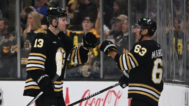 Boston Bruins forwards Charlie Coyle and Brad Marchand