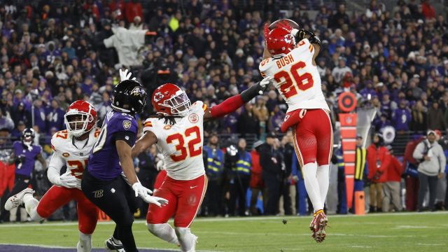 Kansas City Chiefs safety Deon Bush and Baltimore Ravens tight end Isaiah Likely