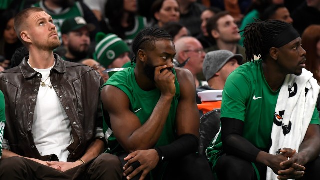 Boston Celtics players Kristaps Porzingis, Jaylen Brown and Jrue Holiday
