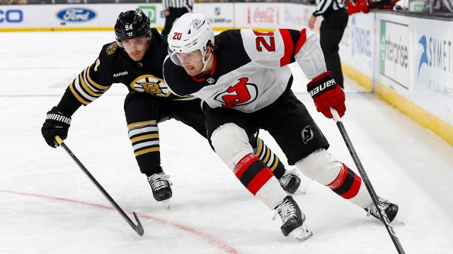 Boston Bruins forward Jakub Lauko and New Jersey Devils forward Michael McLeod