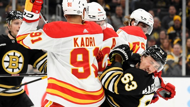Boston Bruins left wing Brad Marchand and Calgary Flames center Martin Pospisil