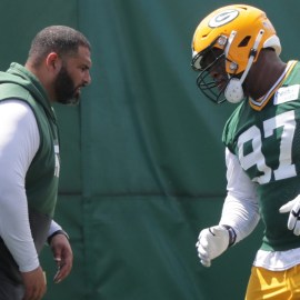 New England Patriots defensive line coach Jerry Montgomery, Green Bay Packers defensive tackle Kenny Clark