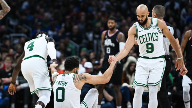 Boston Celtics teammates Jrue Holiday, Jayson Tatum and Derrick White