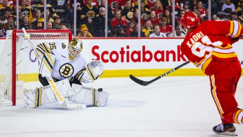 Boston Bruins goalie Linus Ullmark and Calgary Flames forward Nazem Kadri