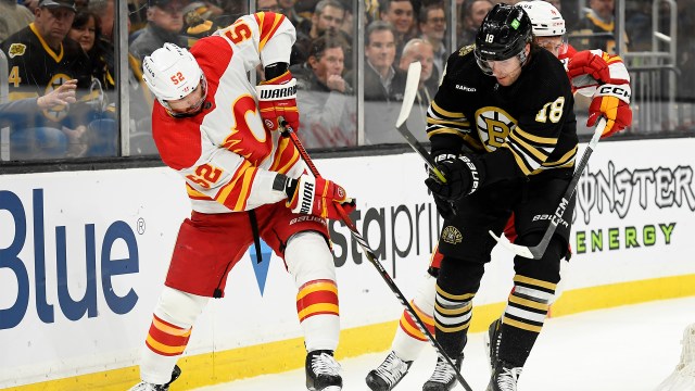 Calgary Flames defenseman MacKenzie Weegar and Boston Bruins forward Pavel Zacha
