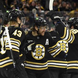 Boston Bruins forward David Pastrnak and teammates
