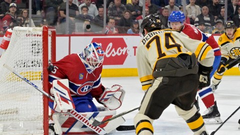 Boston Bruins forward Jake DeBrusk and Montreal Canadiens goalie Sam Montembeault