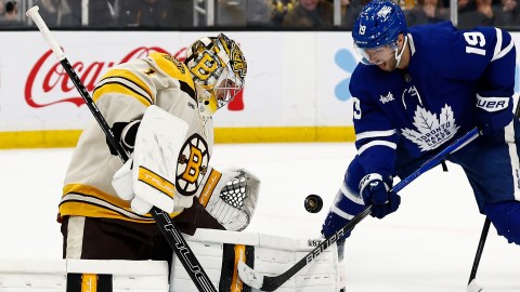 Boston Bruins goaltender Jeremy Swayman and Toronto Maple Leafs forward Calle Jarnkrok
