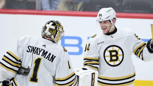 Boston Bruins goaltender Jeremy Swayman and forward Jakub Lauko