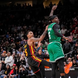 Boston Celtics guard Jrue Holiday and Atlanta Hawks guard Dejounte Murray