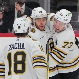Boston Bruins forwards David Pastrnak and Pavel Zacha and defenseman Charlie McAvoy