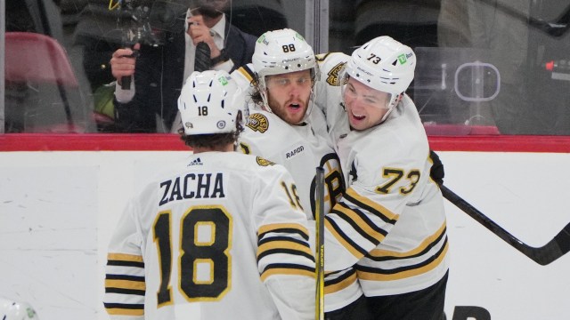 Boston Bruins forwards David Pastrnak and Pavel Zacha and defenseman Charlie McAvoy