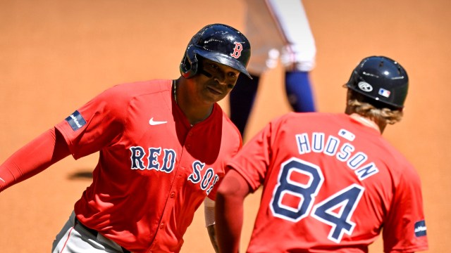 Boston Red Sox third baseman Rafael Devers and third base coach Kyle Hudson