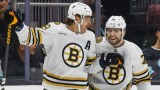 Boston Bruins forwards David Pastrnak, Jake DeBrusk