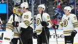 Boston Bruins players Jeremy Swayman, Brandon Carlo, Trent Frederic and Charlie McAvoy