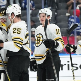 Boston Bruins players Jeremy Swayman, Brandon Carlo, Trent Frederic and Charlie McAvoy